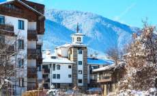 depositphotos 134110108-stock-photo-houses-and-snow-mountains-panorama